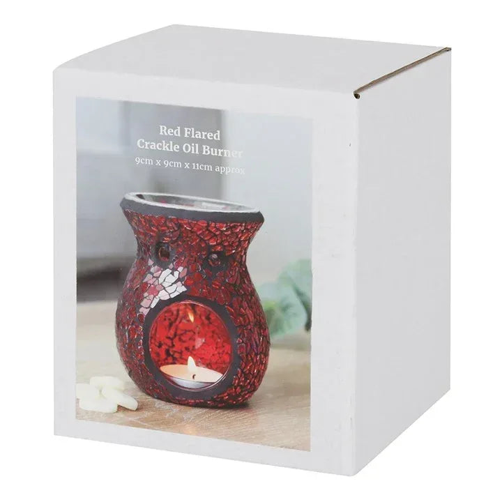 Red flared crackle glass oil burner with candle opening shown in retail box