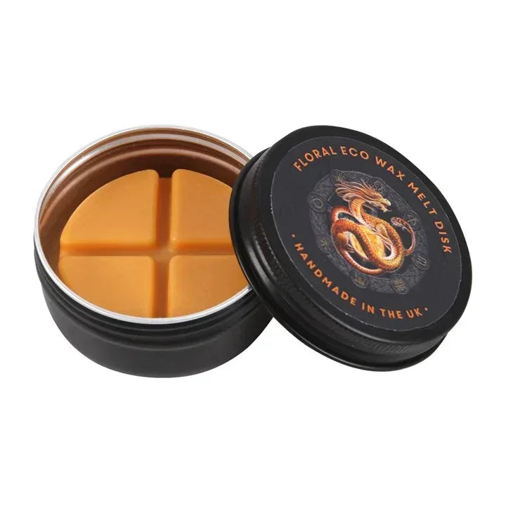 Black wax melt jar lid open, showing orange wax cubes with dragon label