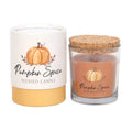 Pumpkin-scented scented candle jar set with white label, gold base, and cork lid
