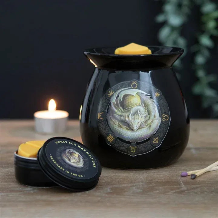 Black wax melt burner with dragon front, tealight and honey wax melt pot on table