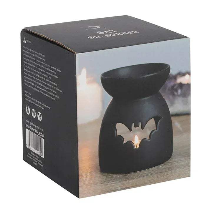 Black bat cut-out oil burner in retail box packaging