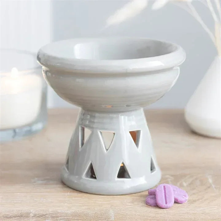 Gray ceramic oil burner and wax warmer with perforated base for tea lights