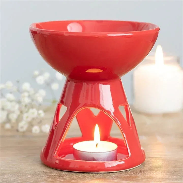 Red ceramic oil/wax burner with lit tealight candle
