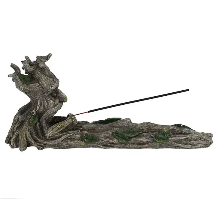 Gray resin incense stick holder showing the reclining tree spirit and extended black stick