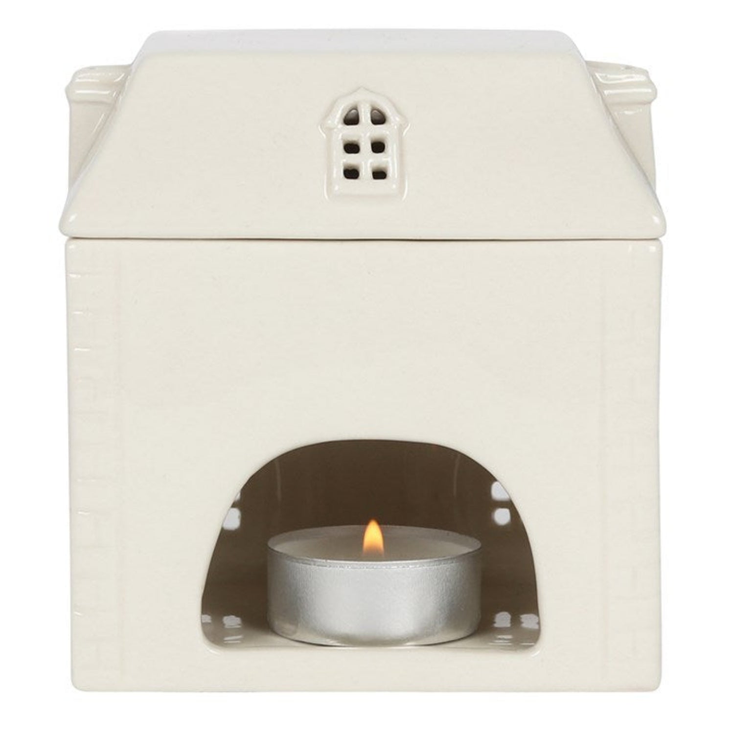 White ceramic oil burner with a small candle inside on a white background