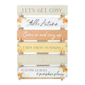 Autumn block sign set on display: stacked wooden blocks with fall quotes and pumpkins