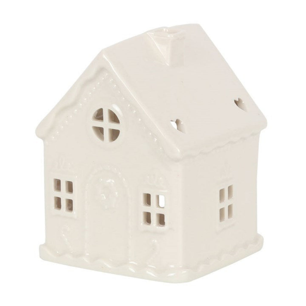 White ceramic house-shaped lantern on a white background