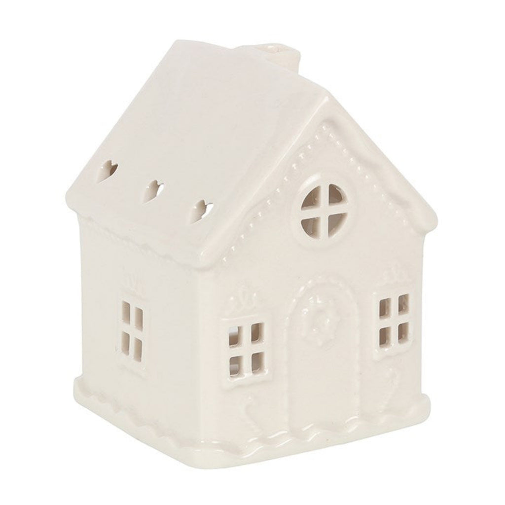 White ceramic house-shaped lantern on a white background