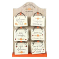 Mini hanging autumn signs on display board, featuring pumpkins, leaves, and welcome text.