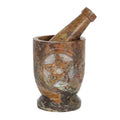 Stone pentagram mortar with pestle, mottled brown carved bowl and symbol