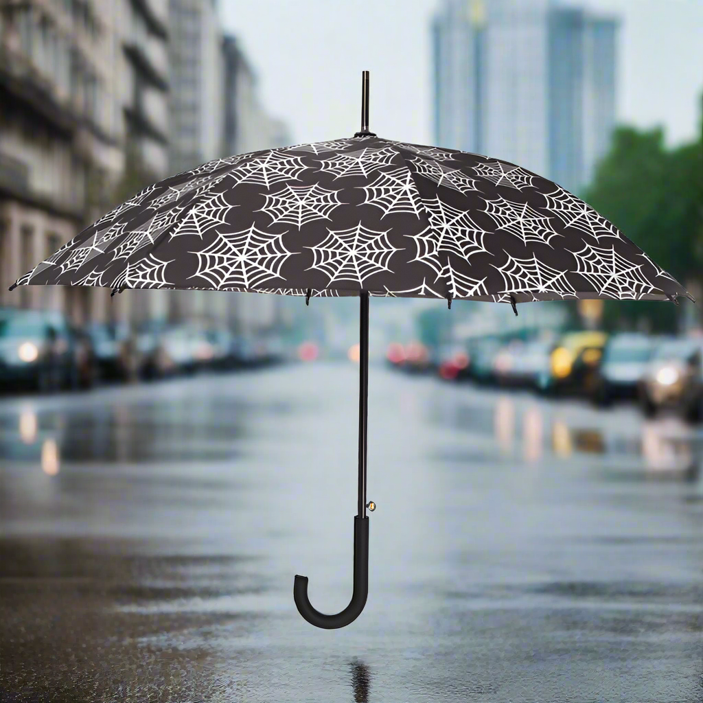 Umbrella with spider web pattern on a white background