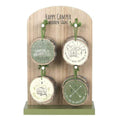 Set of 4 camping wood slice signs on display with green hanging cords