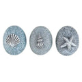 Set of resin pebble ornaments with shell, starfish, and clam designs, blue-gray