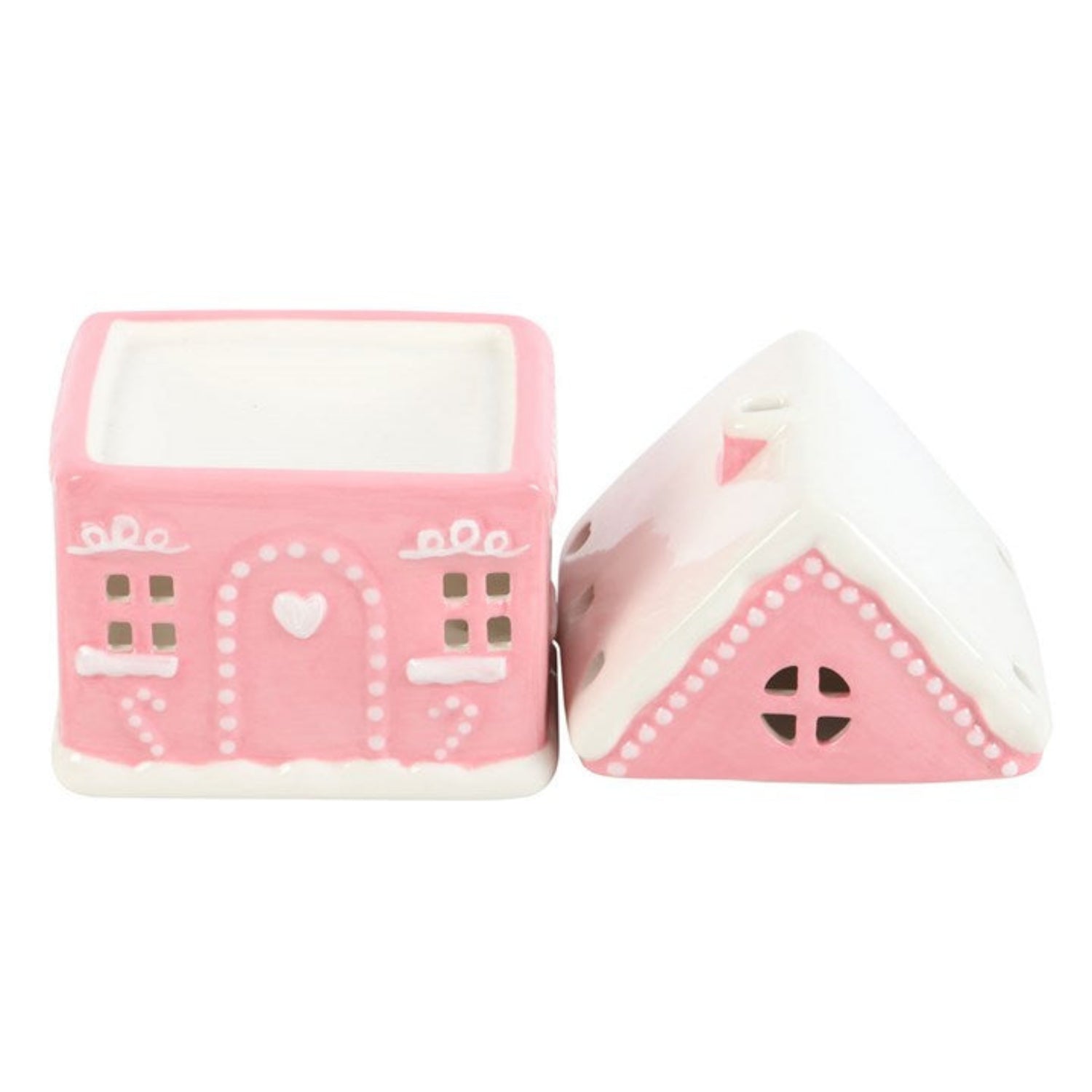 Two pink toy blocks with house designs on a white background