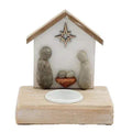 Nativity tealight candle holder shaped like a small house with star and gray figures