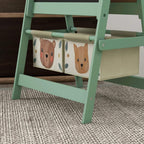 Green kids art easel storage bins with bear-pattern fabric panels, under the frame.
