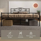 Black metal bed frame with headboard and footboard, slatted base with storage space