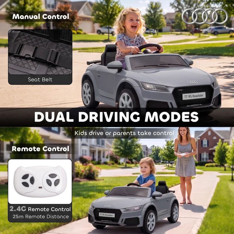 Grey ride-on electric car with child seated and open cockpit front seats