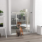 White pressure fit dog safety gate installed in doorway with a dog behind