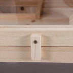 Natural wood corner joint with metal screw detail on a rodent hutch