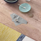 Brown wood-grain dining tabletop with place settings, bowls, and plates