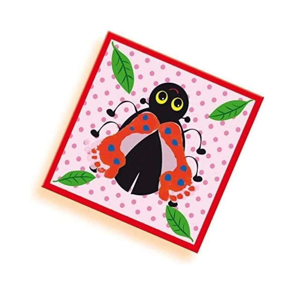Ladybug handprint art card with black insect, red dots, and green leaves