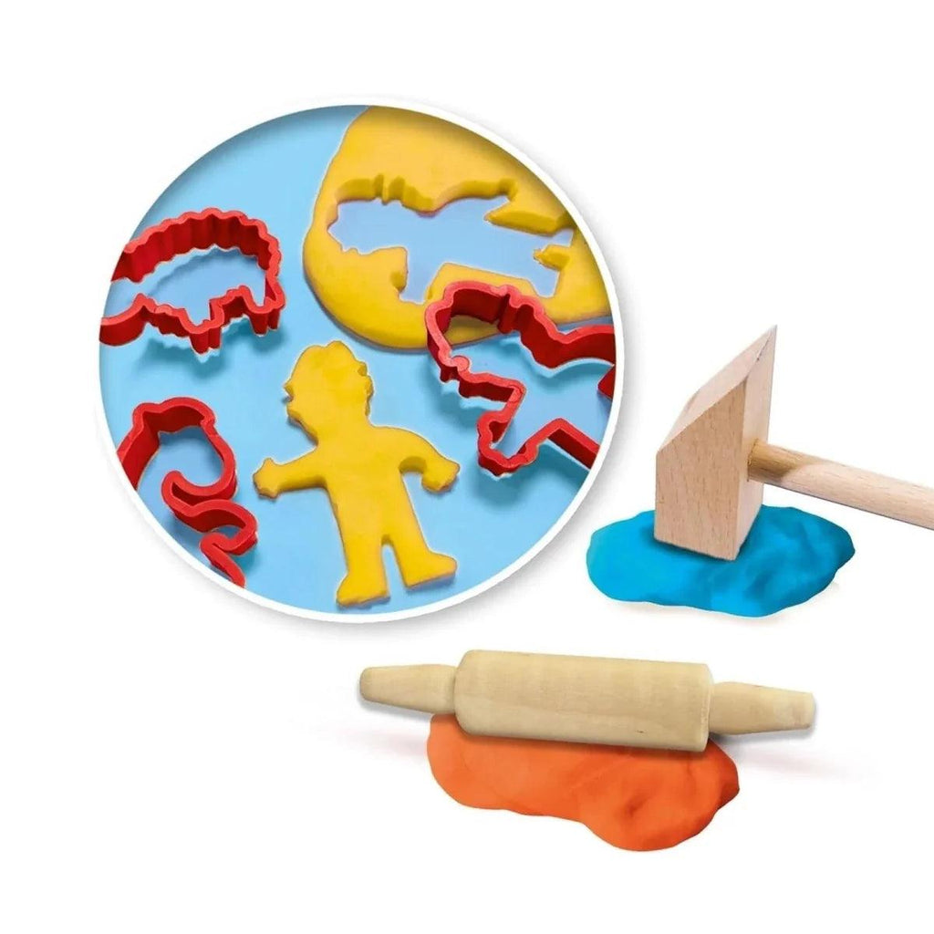 Round dinosaur dough stamp, wooden tools, and orange-blue playdough pieces