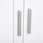White cabinet door pull handles on a bathroom floor cabinet.