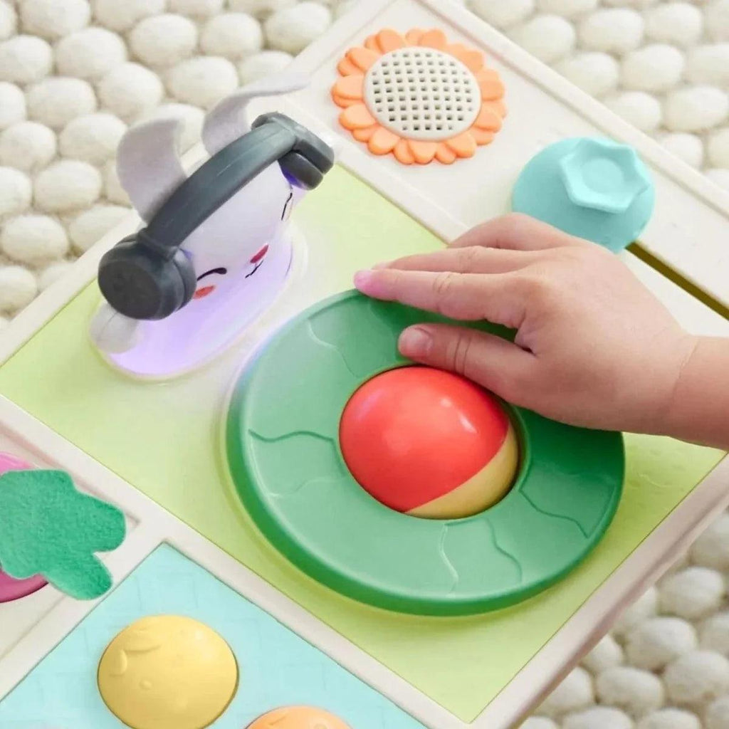 Interactive turntable panel with green tray and red beet slider, bunny head speaker