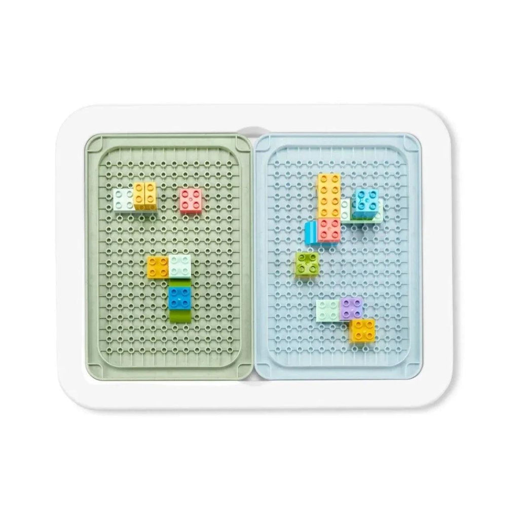 Two-compartment pegboard insert with multicolor building pieces
