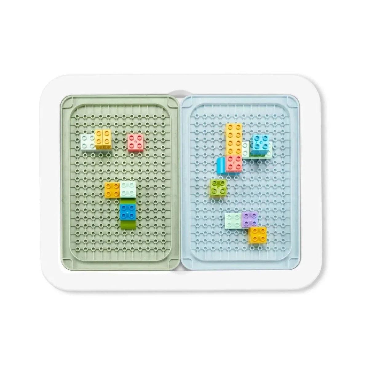 Two-compartment pegboard insert with multicolor building pieces