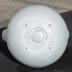 Light grey 12 kg kettlebell underside with circular plate and mounting holes