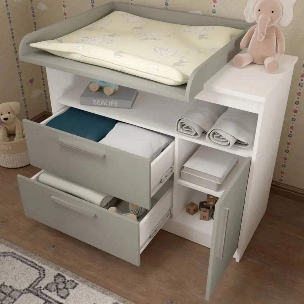 Grey and white changing unit with open cabinet, changing pad, and folded liners