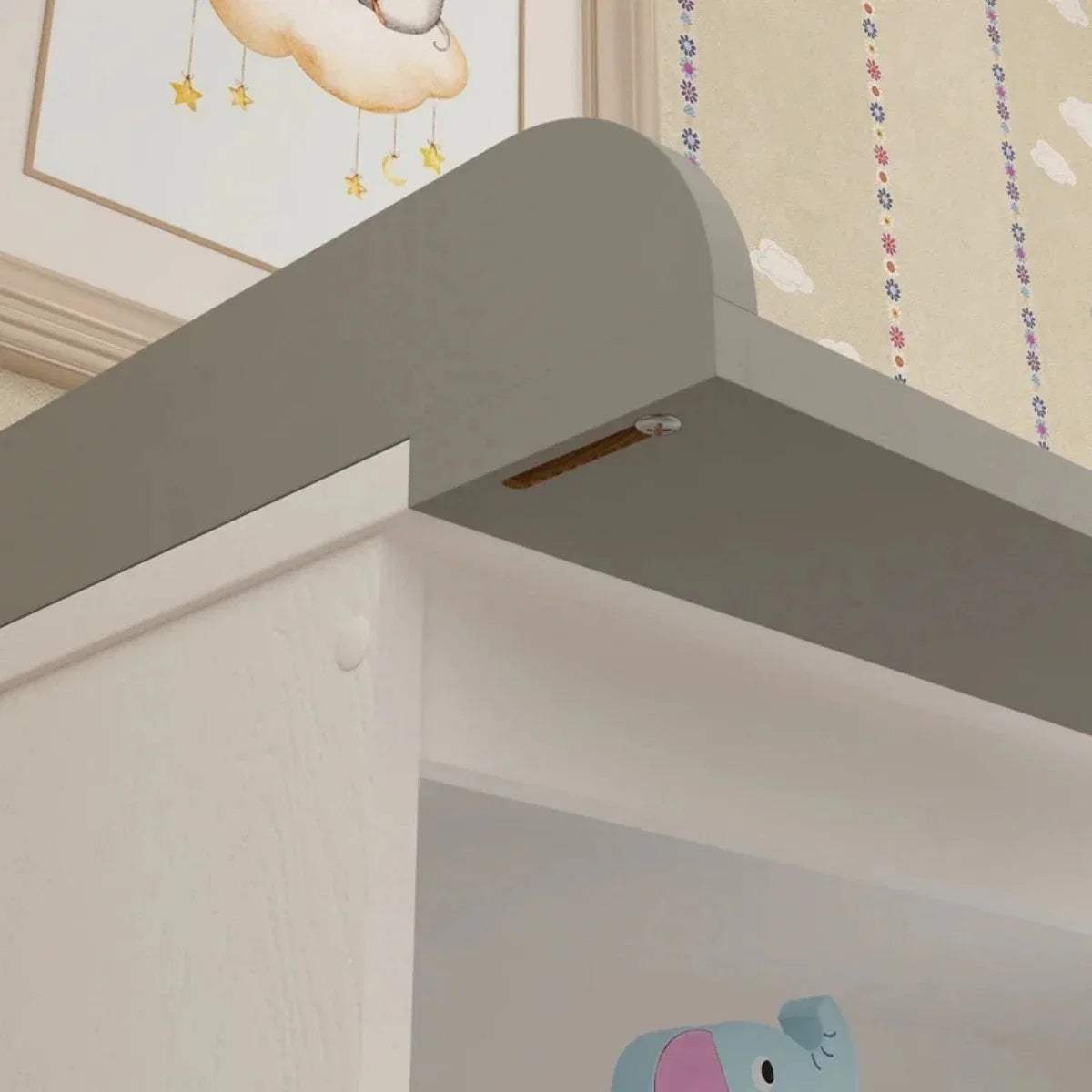 White and grey changing unit interior with padded changing surface