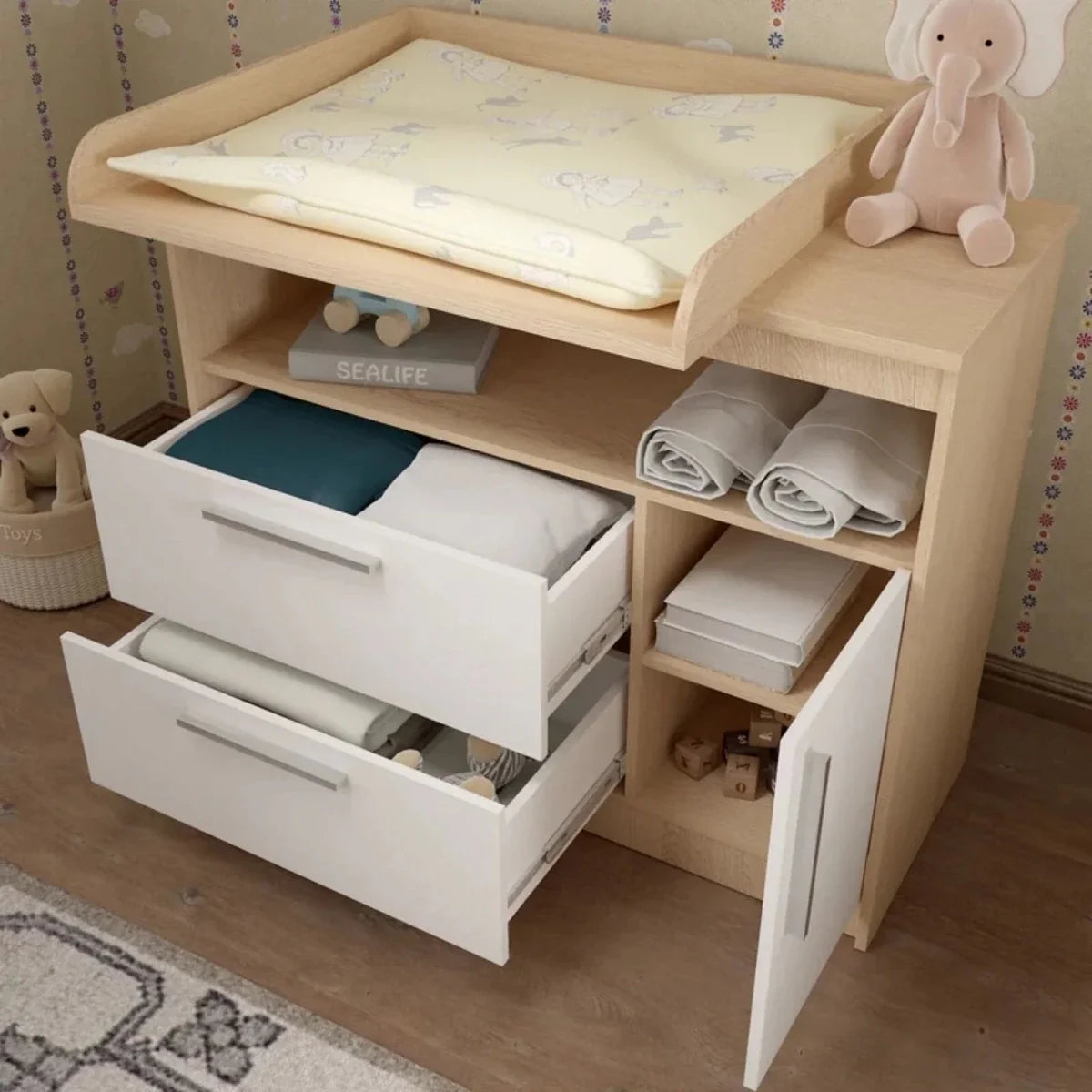Shefa kids changing unit with open drawers, changing pad on top, and side shelving