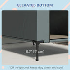 Grey elevated dog house with raised legs under base; clearance measurement shown.