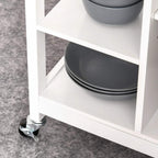 White open shelving kitchen trolley with dark bowls on a lower shelf and caster