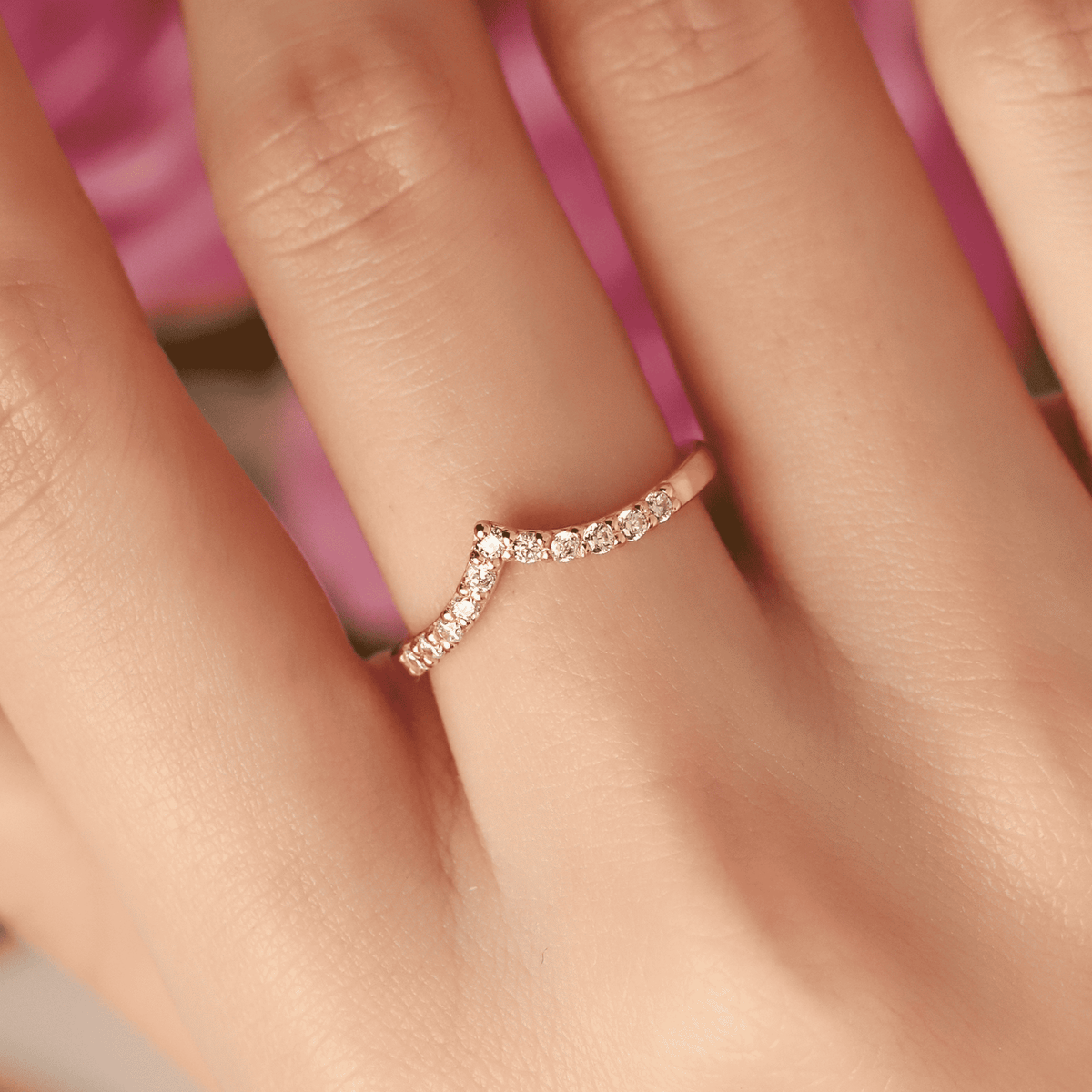 Wishbone curved eternity ring in gold vermeil with pavé stones on finger