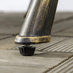 Bronze cast aluminum bistro table leg with protective foot on outdoor decking