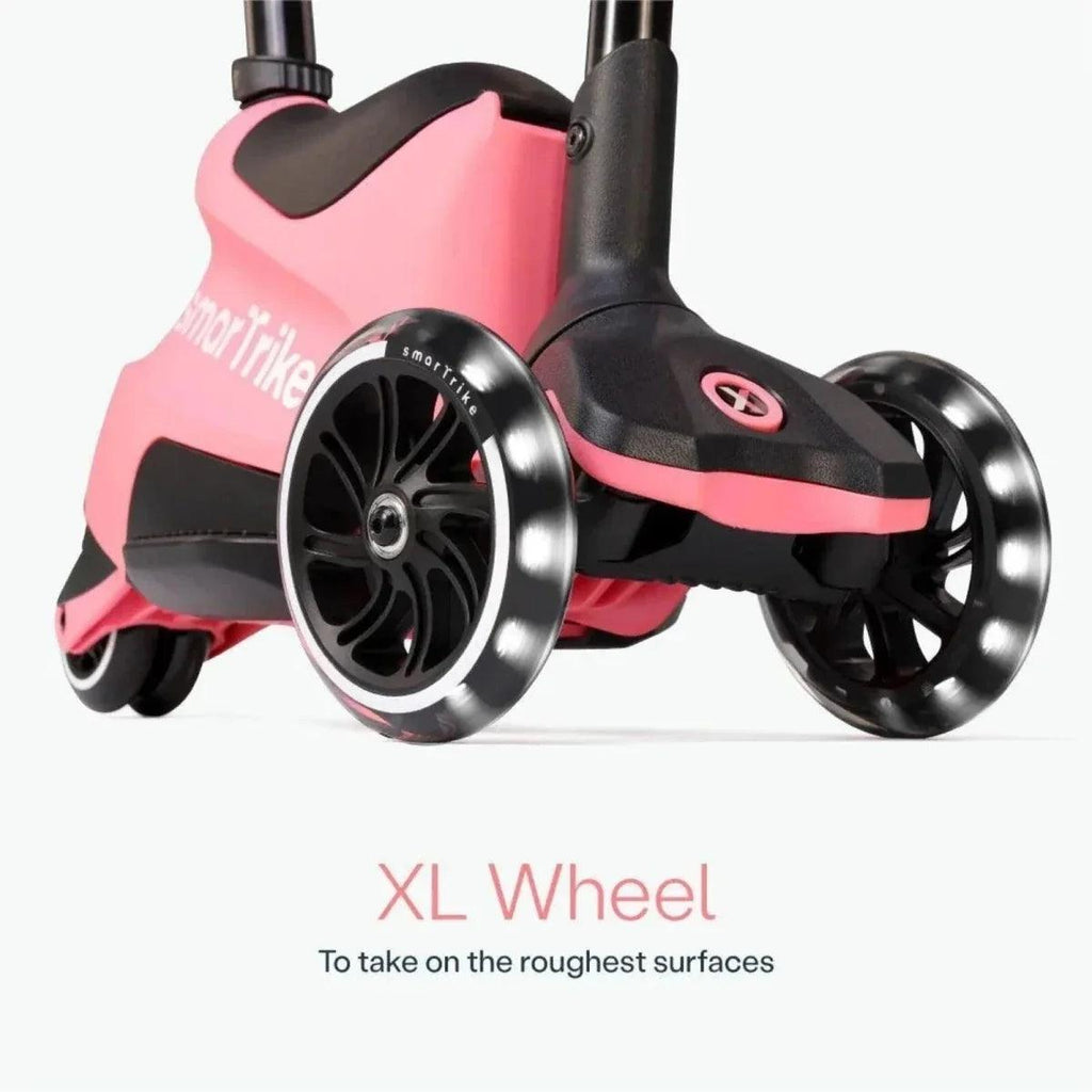 Close-up of salmon pink smarTrike scooter with XL front wheels and black frame