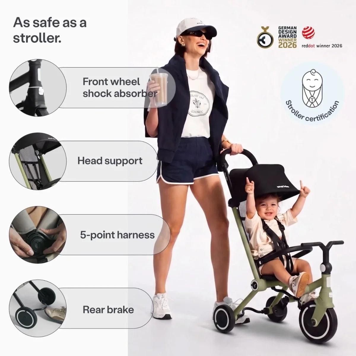 Olive stroller trike with black canopy, 5-point harness, and rear brake