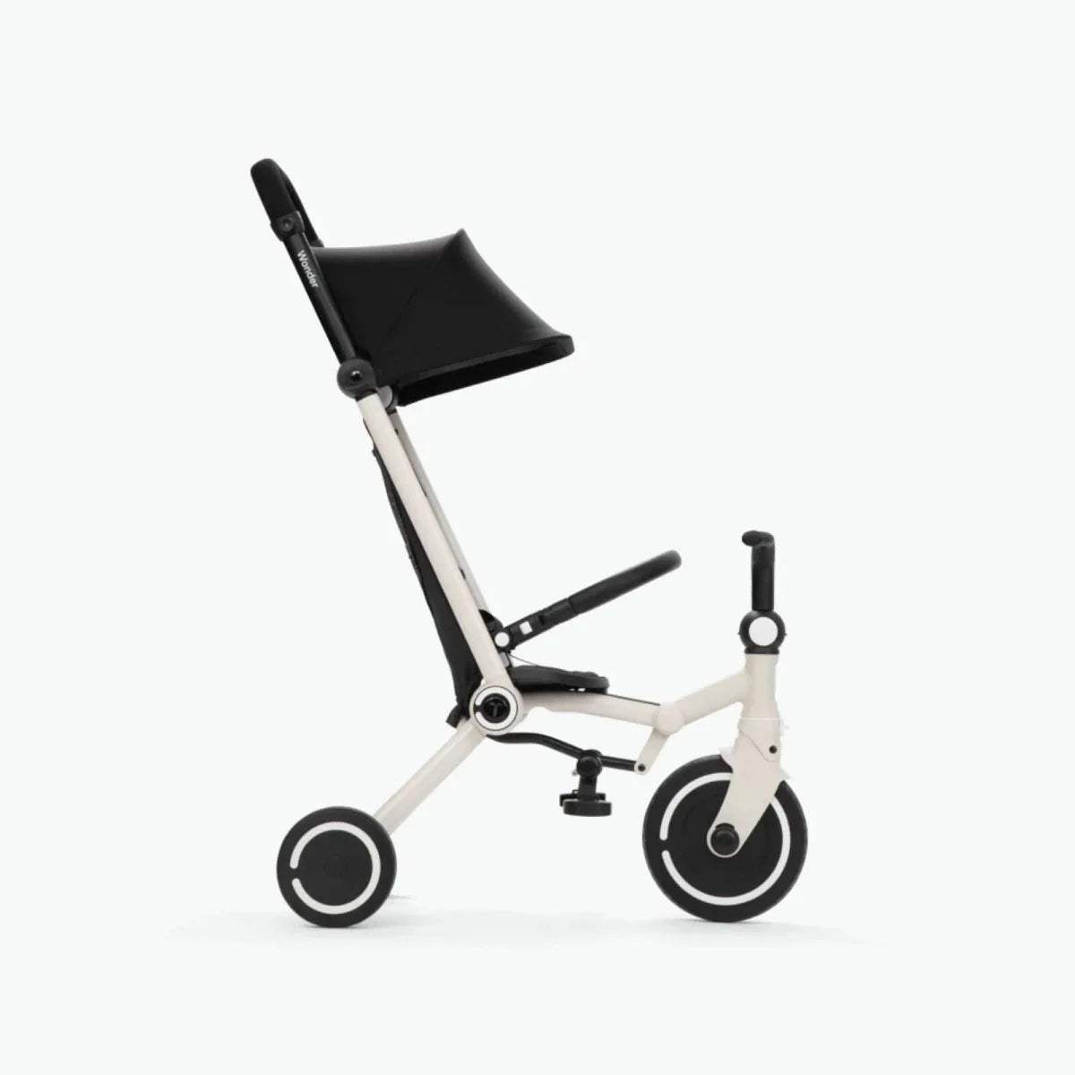 Black-and-white compact stroller with canopy, front wheel, and adjustable handlebar