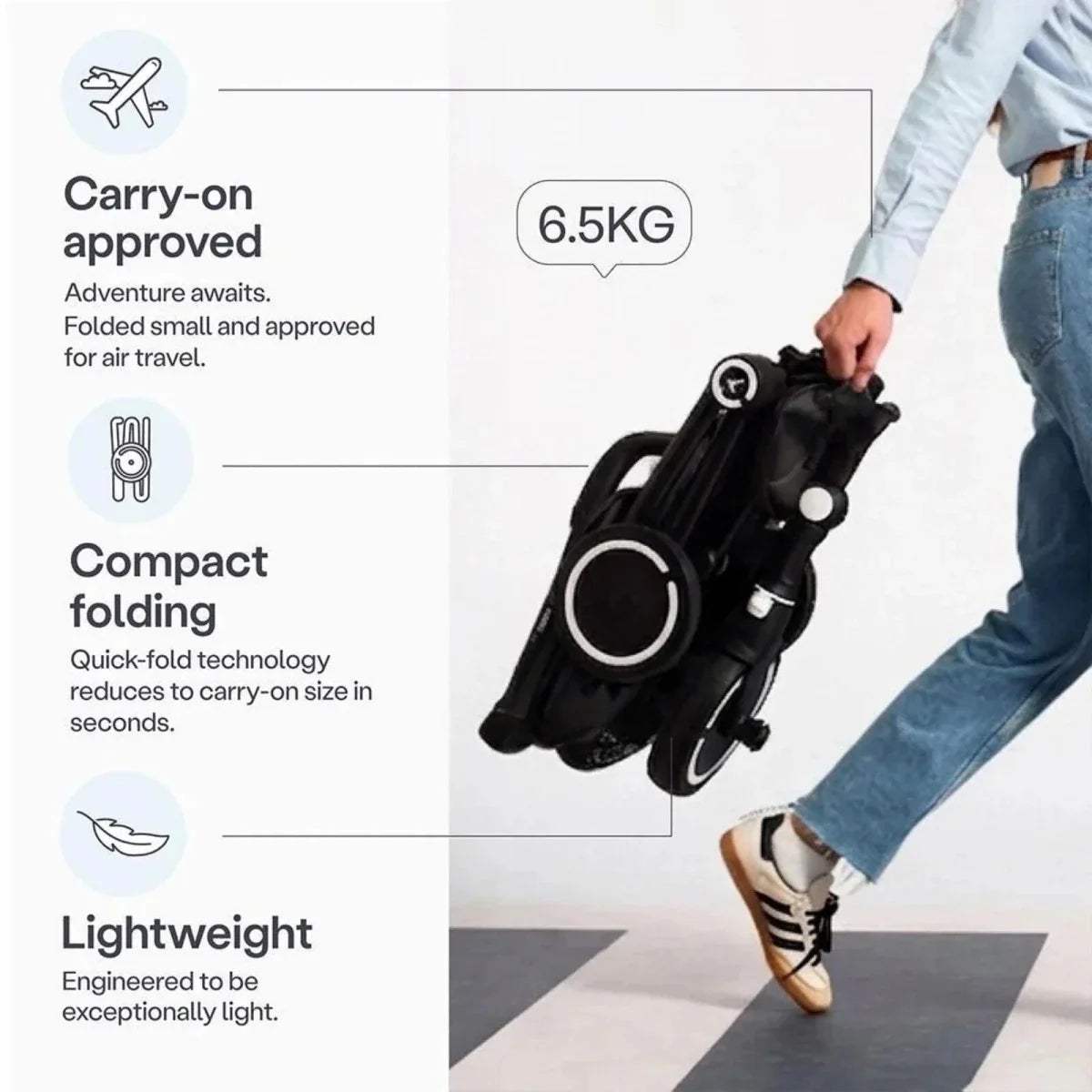 Jet black compact stroller trike with carry-on handle and quick-fold design