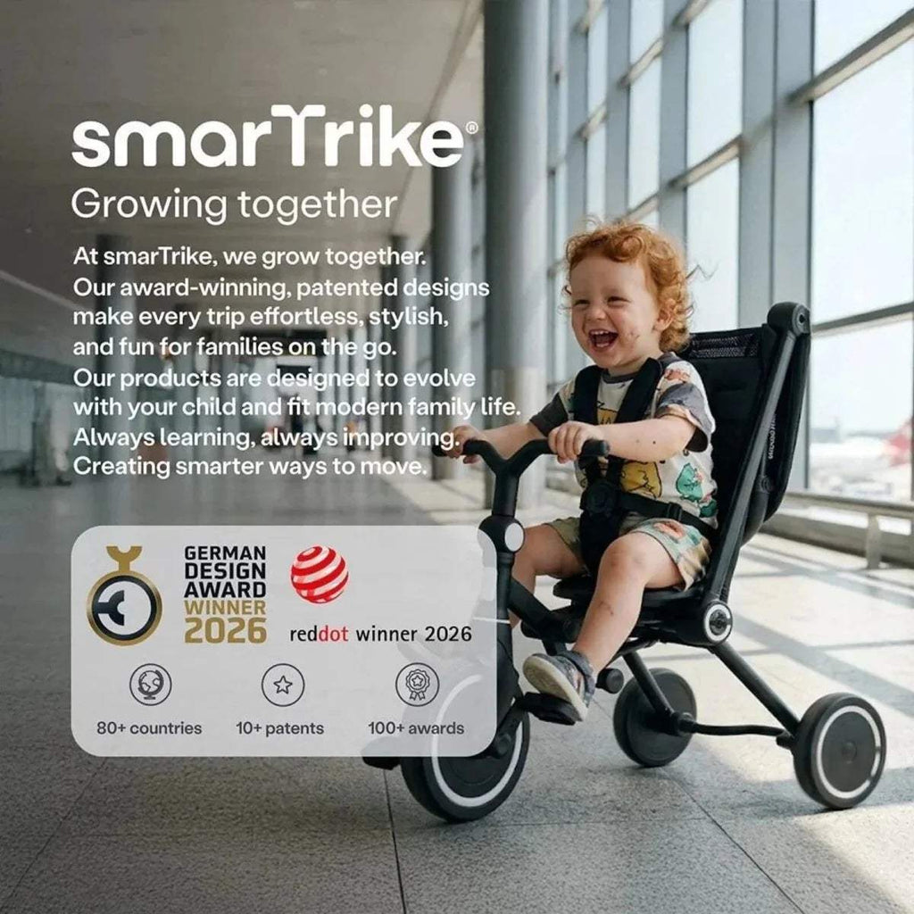 Jet black stroller trike with child seated, large canopy and front wheels
