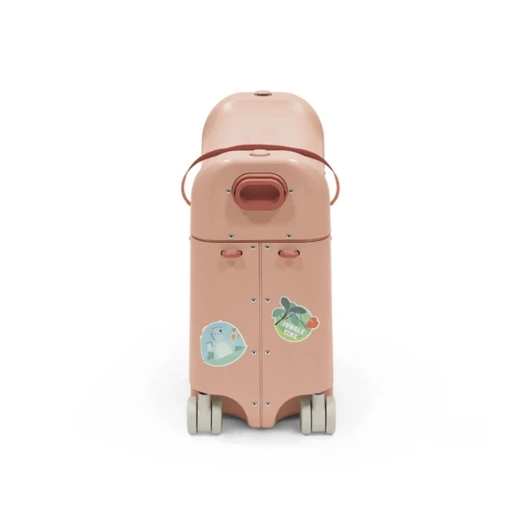 Coral pink BedBox ride-on suitcase back view with rear handle and wheels