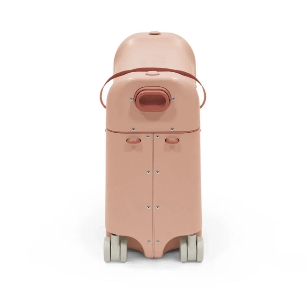 Coral pink BedBox ride-on suitcase back panel with rear handle and four rolling wheels