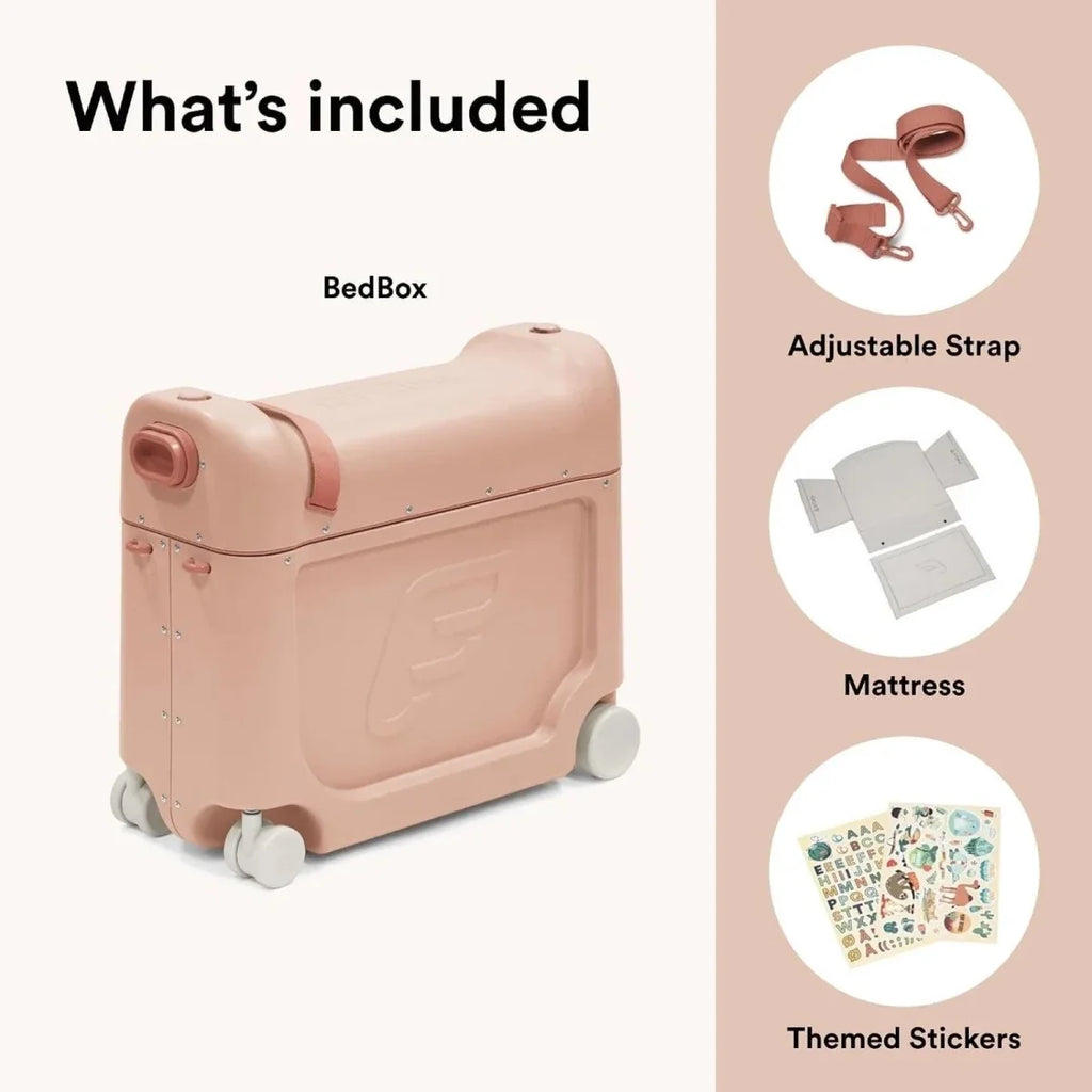 Coral pink BedBox ride-on suitcase with included strap, mattress, and themed stickers