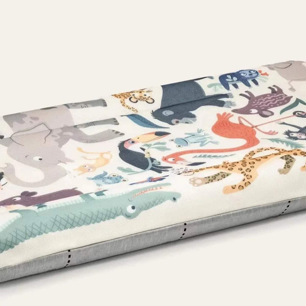 Side view of animal print inflatable kids travel bed with gray base trim