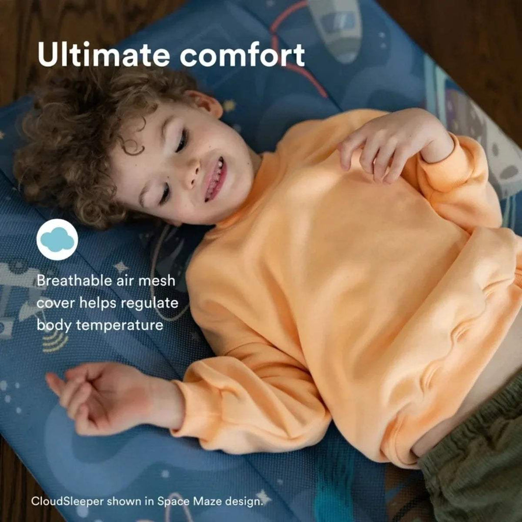 Stokke Jetkids CloudSleeper travel bed with blue space print and orange cover