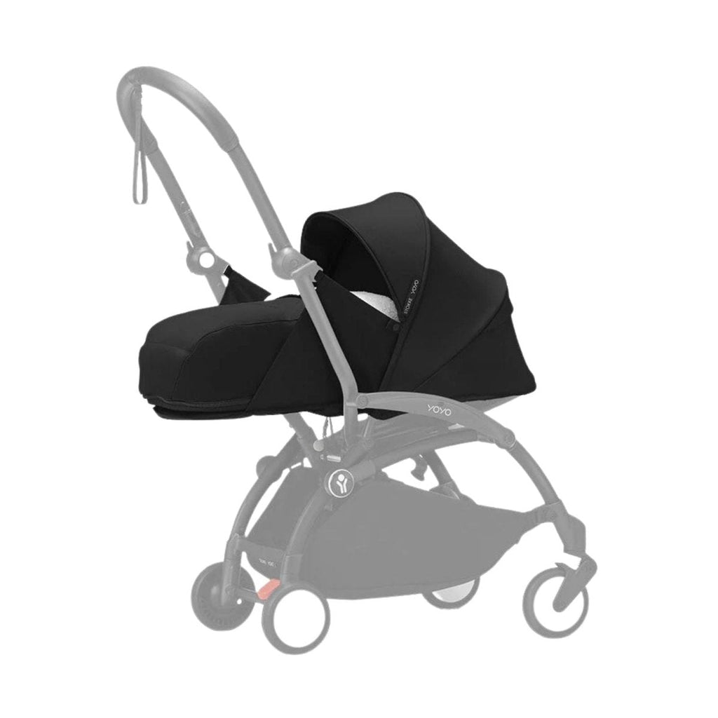 Black newborn stroller set with canopy and carrycot on wheels